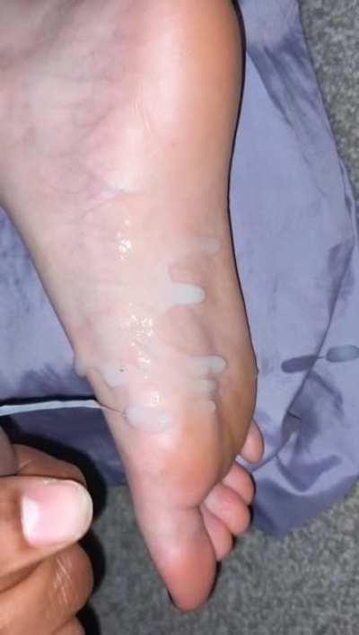 Sticky cumshot on long soles