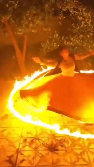 A girl performing Sama (a type of Persian dance)