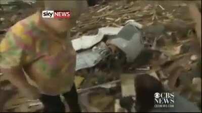 This tornado survivor found her dog in the rubble while on air