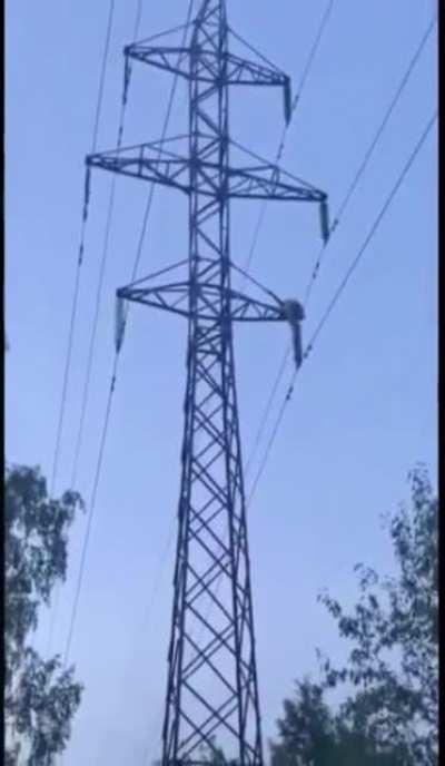Drunk Russian climbs transmission tower.