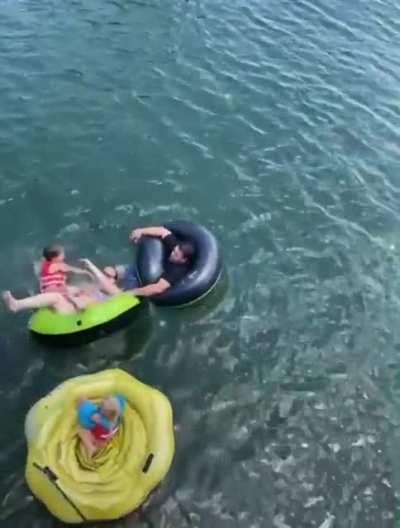 Enjoying a nice day in the water until this kid jumps in