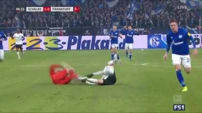 Soccer Goalie kung fu kicks his opponent during a Soccer game.