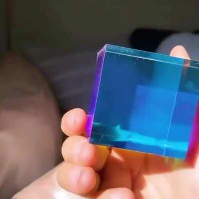 A real-time example of subtractive color mixing. As white light travels through various colored sides, both wavelengths are reduced, revealing the full color spectrum.