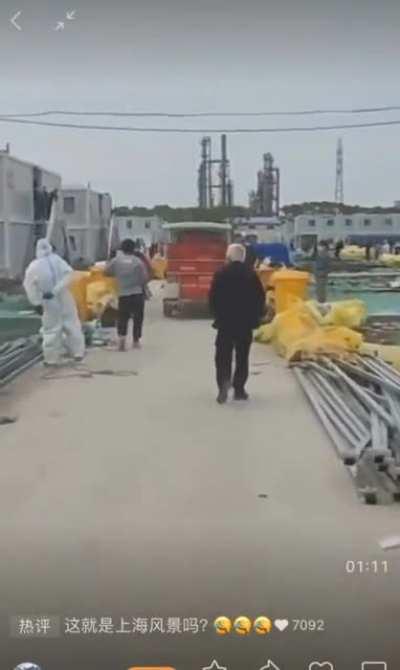 Trying to get food in Shanghai quarantine camp