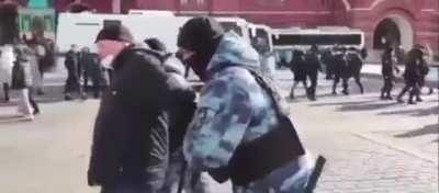 Fearless man sings the Ukrainian national anthem at an anti-war protest near the Red Square in Moscow Russia.