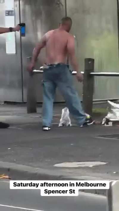 Melbourne man being arrested after robbing two alcohol shops.