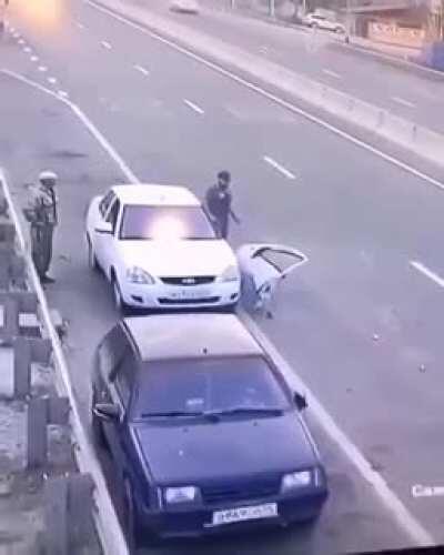 And this is why you check your rear view mirror and side mirror. Also why, when you pull over, pull over as far off the road. And turn your Hazzard lights on... But then proceeds to stand there with his back to oncoming traffic? Not sure he learnt the les