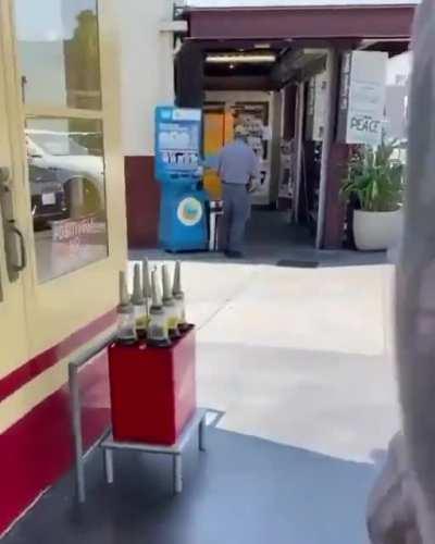 Andre3000 spotted walking around with one big ass flute.