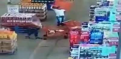 A man throws a shopping cart at a woman inside a supermarket in Brazil