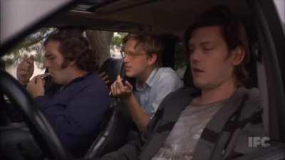 Footage of three guys smoking pot in a car when a squirrel jumps through the sunroof