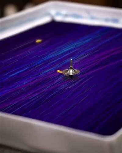 The way the artist creates the painting with various everyday items