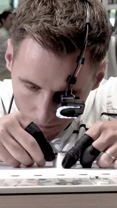 Man demonstrates the making of a Swiss watch