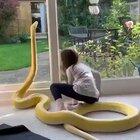 Snake and little girl are best friends