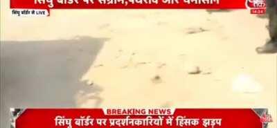 Police just standing with straight face when so called Locals in masks started pelting stones at Farmers tents... Report by India Today's Aneesha Mathur. (Source in Comments)