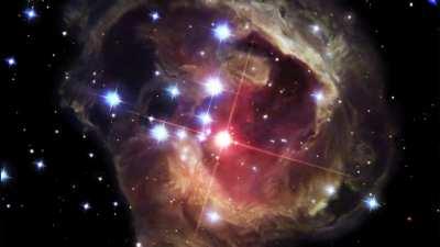 A Light Echo from the star V838 Monocerotis as it suddenly became 600,000 times brighter than our sun, illuminating the dust and gas surrounding it. Captured by Hubble in 2002.