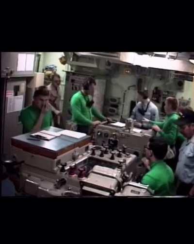 View of USS Missouri sailors in the artillery plotting room under missile and gas attack during Gulf War
