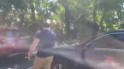 White supremacist group Patriot Front runs away and tries to cover their license plates