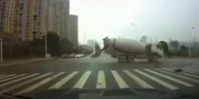 Cement truck slams into an ambulance, causing the patient to be ejected out the back of the ambulance