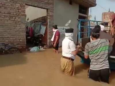 Ranwar village in Karnal was flooded after a canal breached. RSS Swayamsevaks helped villagers to shift their essential goods and provided safe places.