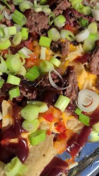 Karma farming at its best. Brisket nachos... Leftover brisket, nacho cheese, shredded cheese, bell pepper, onion, barbecue sauce and green onion