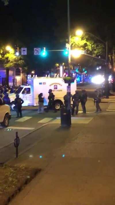 Forming a line and marching further down Broad, lots of sirens and helicopters