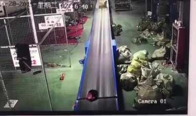 Standing on a conveyor belt.