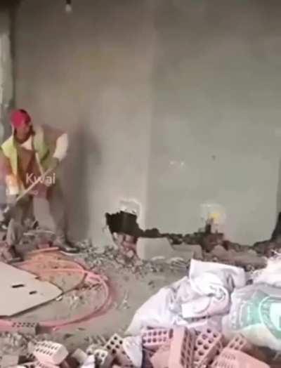 WCGW Walking in-front of a wall being hammered