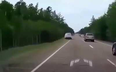 A normal road in Russia. There are two major problems, idiots and roads.