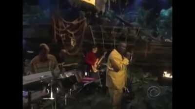 Sekou singing the winners at war song.