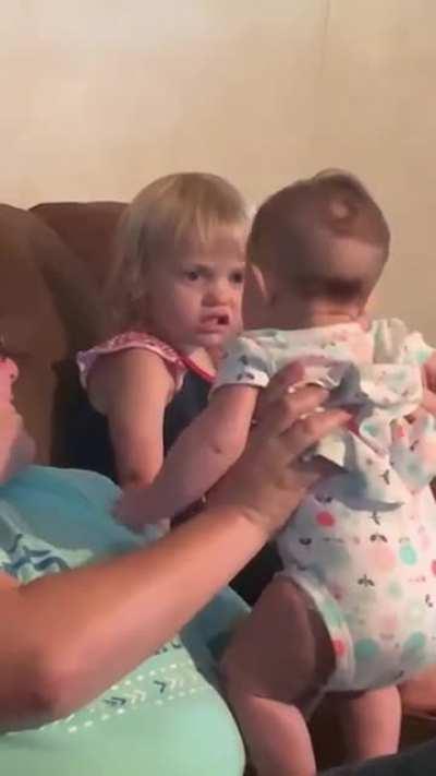 I don't think she likes her new sister.