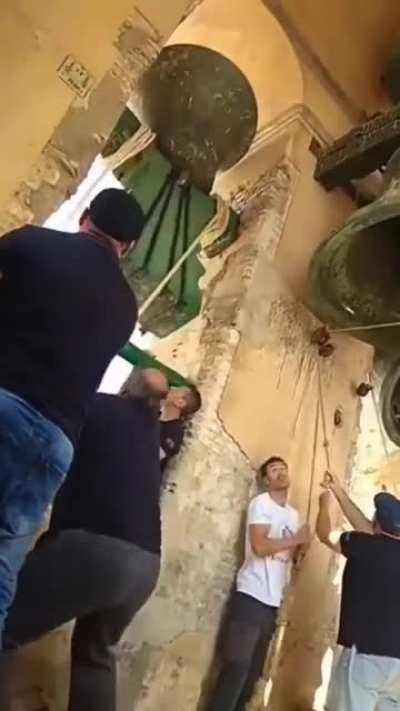 Stopping the church bell.