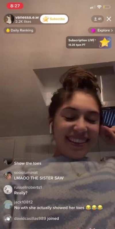 girl shows bottom of soles on live