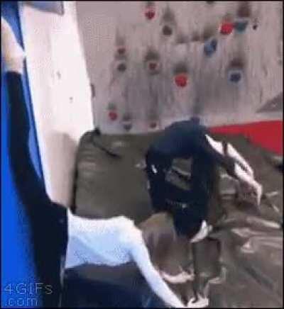 Girl tries to do a back bend, ends up slamming her face into the wall