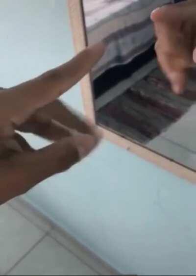 Just a guy playing with a mirror