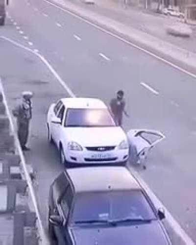 Doesn’t pull all the way over. Opens car into oncoming traffic without looking. Continues to stand in oncoming traffic with back turned. Shrugs like everyone else is stupid except him.