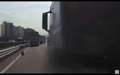 Truck flips over car