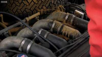 Ferrari mechanics inspecting Vettel's car after FP2