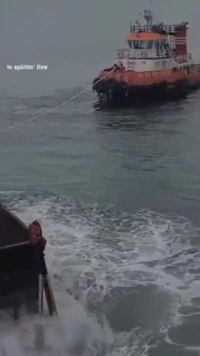 Coal barge in rough seas