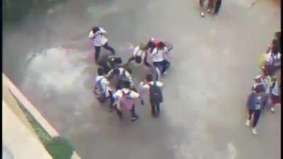 The Boys dancing around a bluetooth speaker