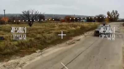 Fiber-Optics FPV drone operator lying in ambush realized he no longer had time to strike the speeding buggy so carried out a remote detonation.