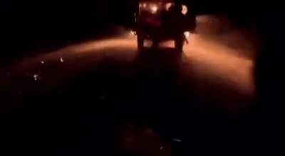 Russian soldier records Ukrainian FPV drone hitting UAZ Bukhanka at night, also falls out