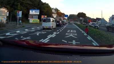 This kid running on the road