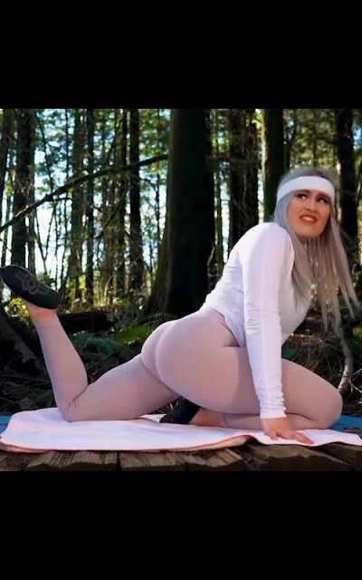 Stretching her booty during yoga