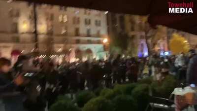 BLM-antifa rioters attack people eating near BLM Plaza in DC. They throw an explosive mortar and other projectiles at them
