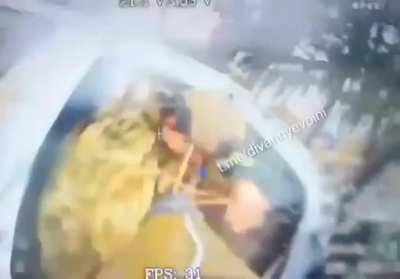 A Russian fiber-optic FPV drone strikes a Ukrainian in the head while he tries to leave a pickup truck