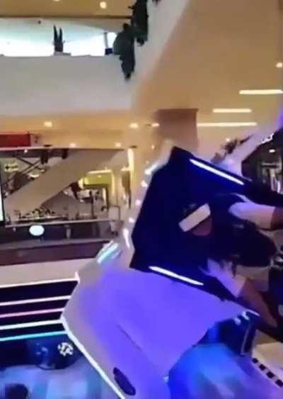 Placing a queue barrier right next to a moving VR simulator