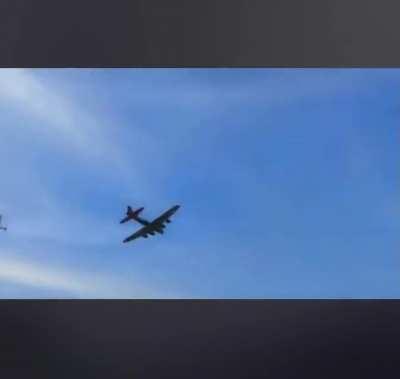 Mid-air collision between a B-17 and a smaller stunt plane at a Dallas air show.
