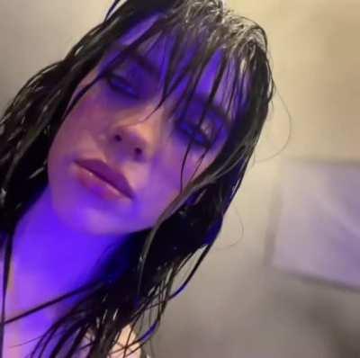 Slowly revealing her cleavage