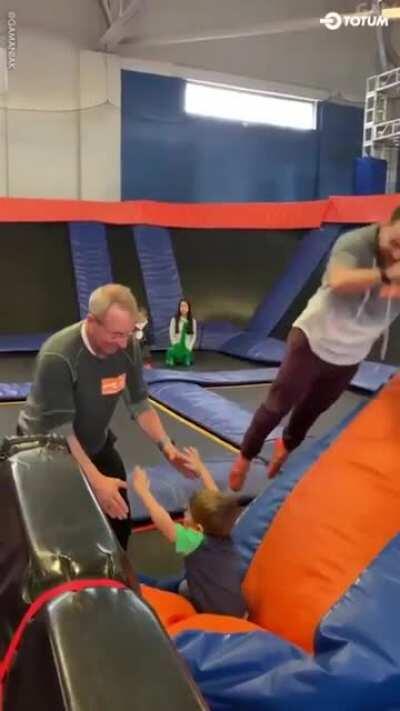 Kid flies over grandpa