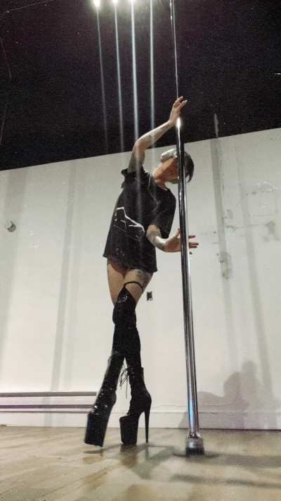 baggy t-shirt, top knot, glasses, headphones, heels, happy place 🖤✨